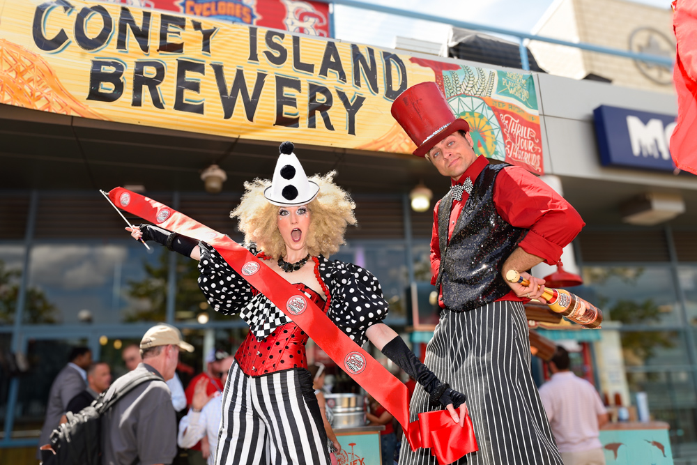 Costumed stilt performers outside Coney Island Brewery