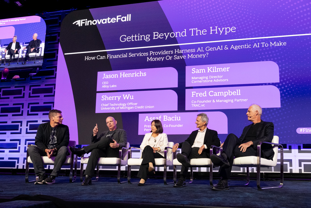 Panel discussion on stage at the FinovateFall conference